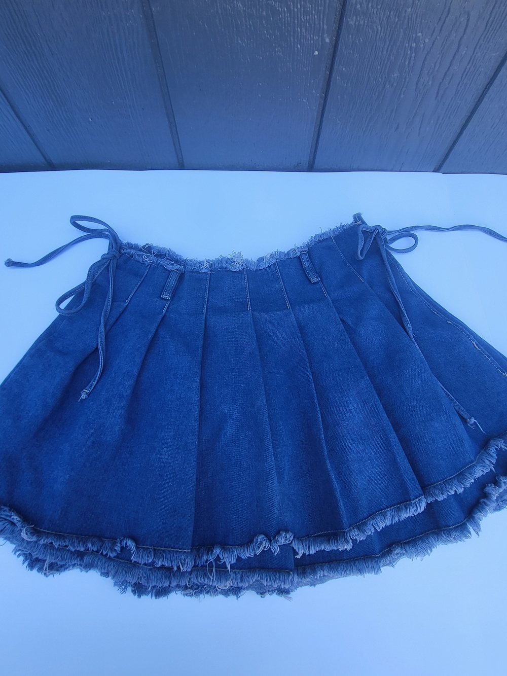 Cider Blue Denim Pleated Mini Skirt with Frayed Hem